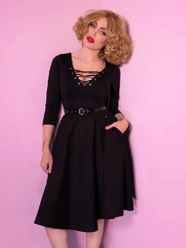 Miss Kitty Swing Dress in Black Smocked unclassified dresses